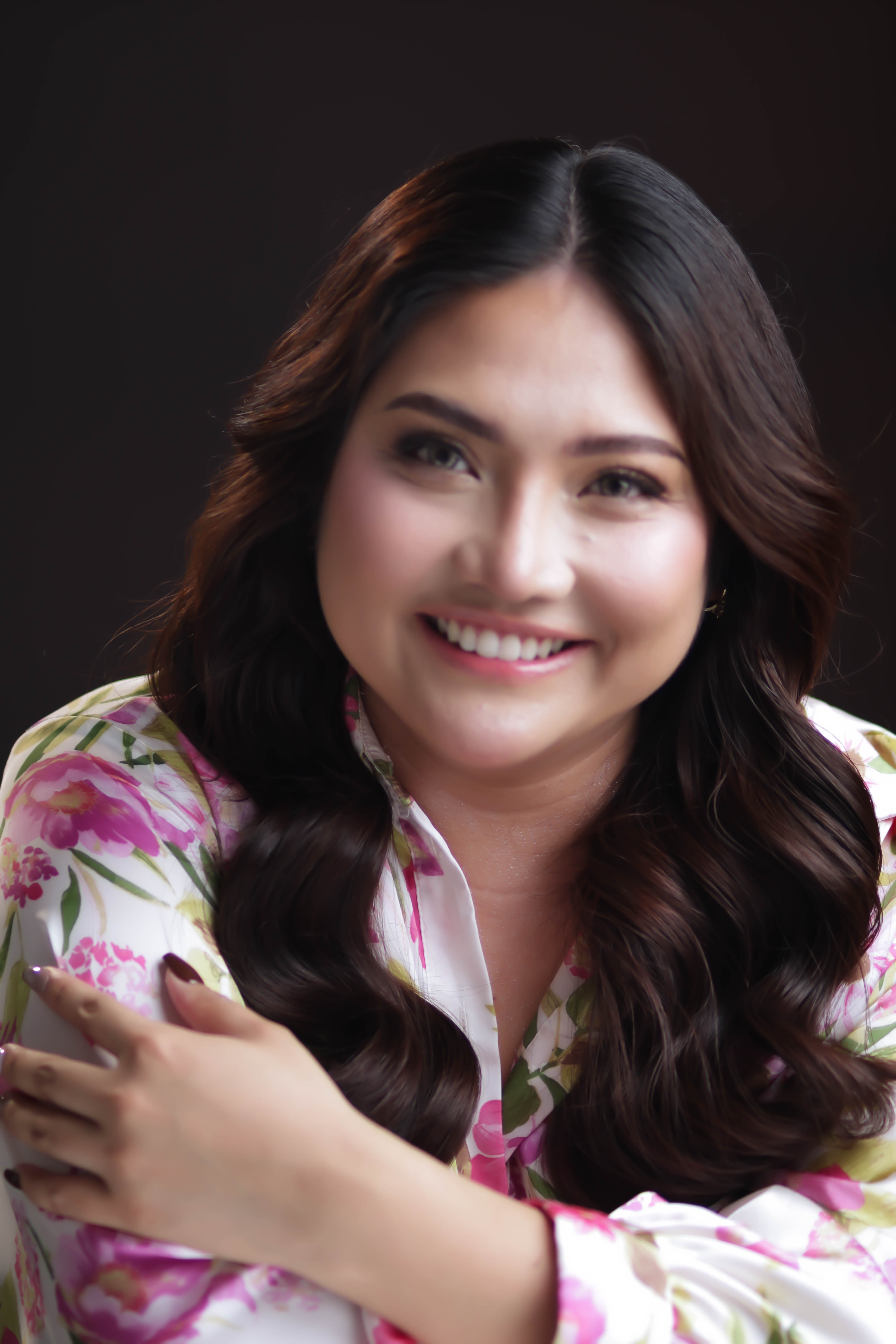 Portrait of Leona Zaid smiling, arms crossed